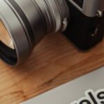 Photography Tours - A camera and a laptop with the word pixels on it