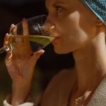 Wine Tours - A woman in a turban drinking wine