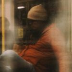 Subways - A blurry image of people on a subway train