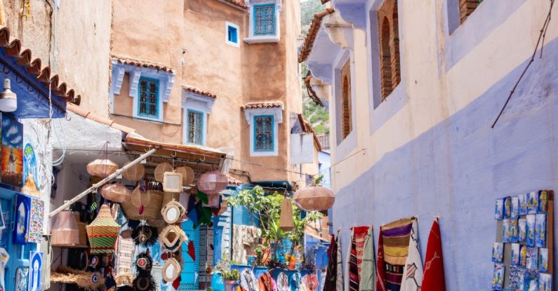 Souvenirs - A narrow alley with blue and white buildings