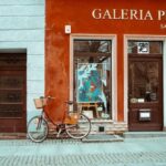 Art Galleries - A bicycle parked outside of a building with a sign that says gallery art
