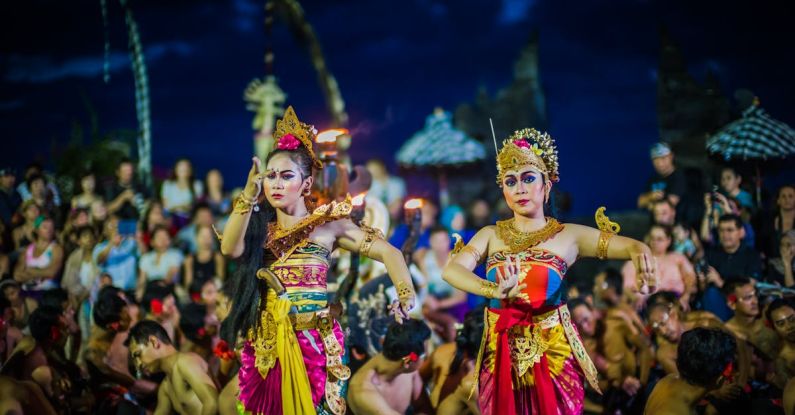 Traditions - Two Women Dancing While Wearing Dresses at Night Time